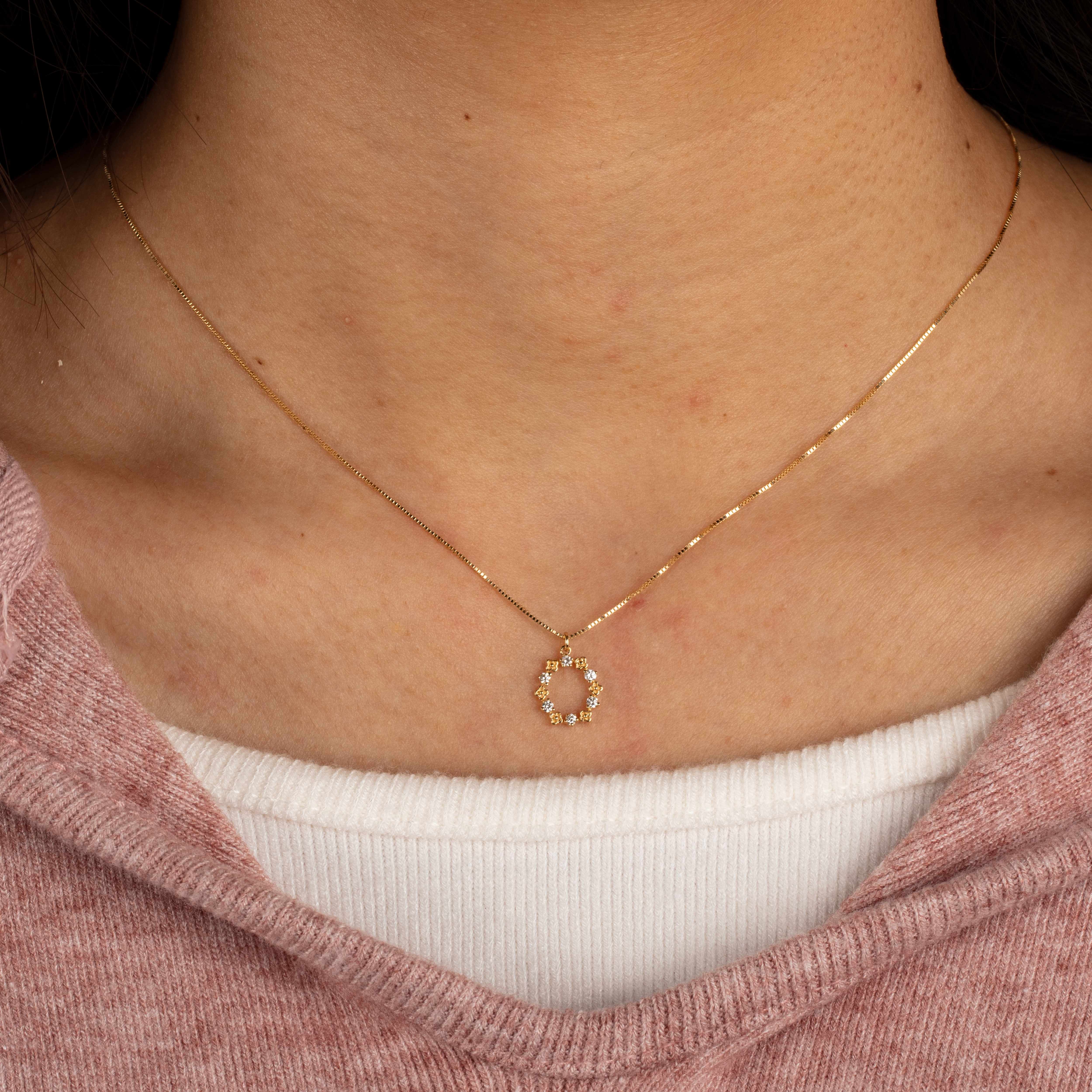 Woman wearing Frank & Label jewellery while reading